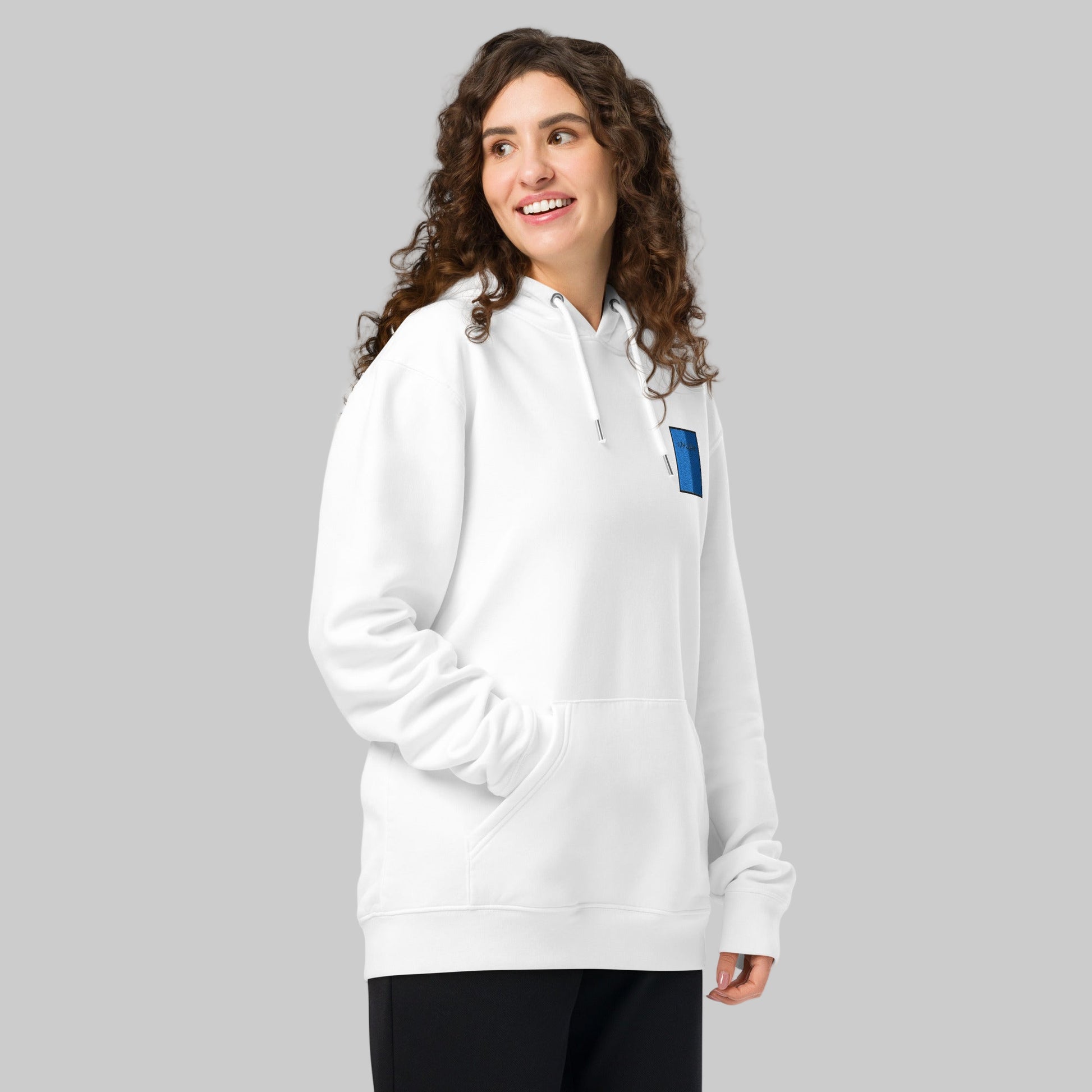 Woman wearing a white hoodie with ÁTH CLIATH emblem 