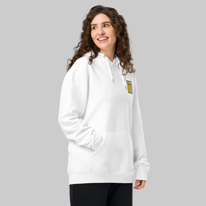 Woman wearing a white hoodie with Antrim emblem 