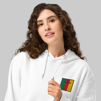 Woman wearing white hoodie with Carlow emblem 