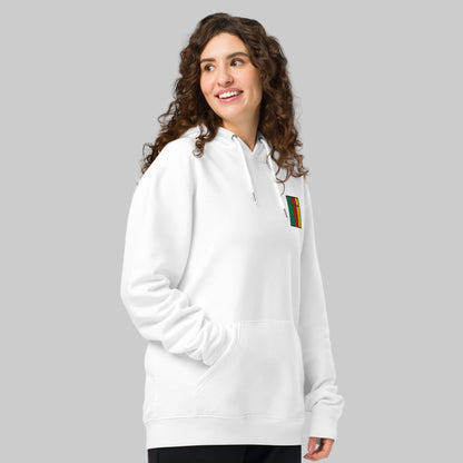 Woman wearing a white hoodie with a Ceatharlach emblem front left