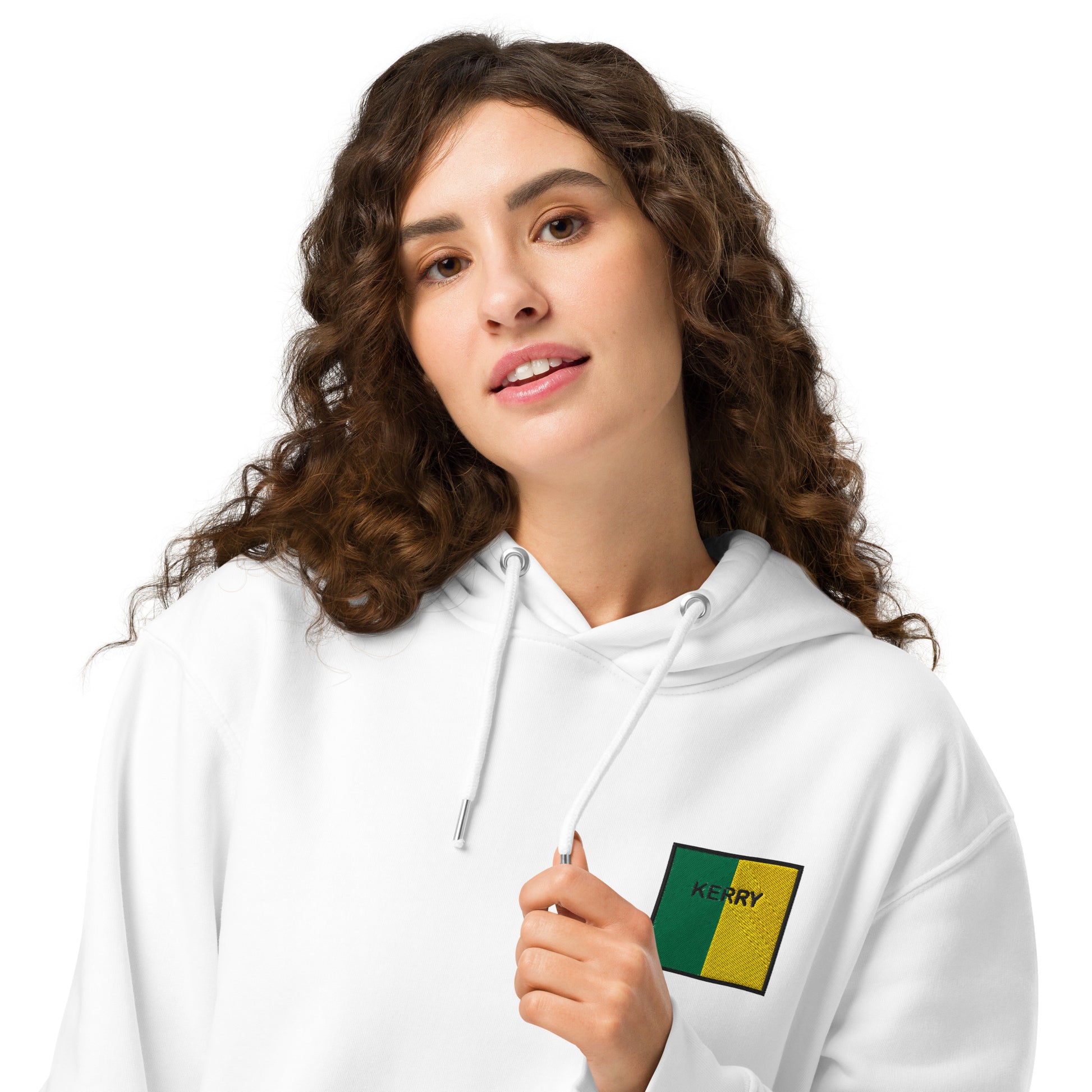 Woman wearing a white hoodie with a Kerry emblem 