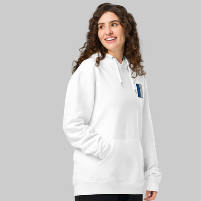 Woman wearing a white hoodie with a Laois embroidered emblem on a white background