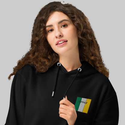 Woman wearing a black hoodie with Offaly embroidered emblem 