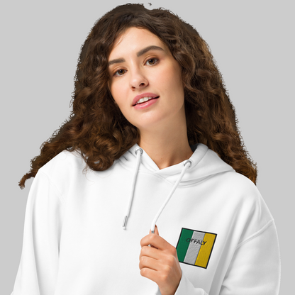 Woman wearing a white hoodie with Offaly emblem on a white background