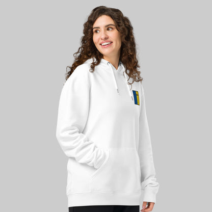 Woman wearing a white hoodie with a Ros COMÁIN emblem 
